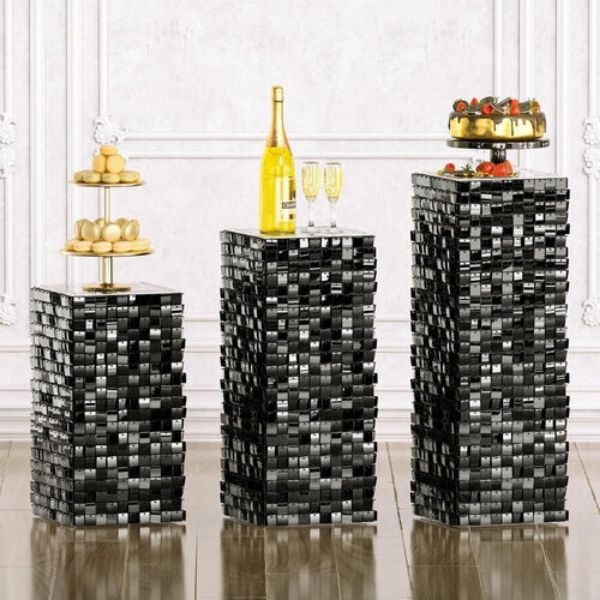 black disco ball stands holding appetizers
